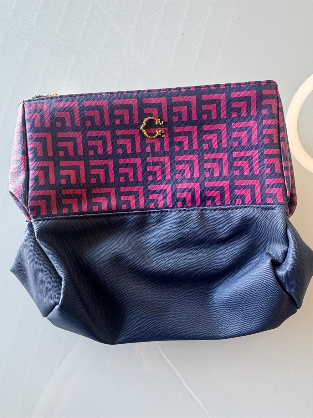 C. Wonder Pink Patterned & Navy Cosmetic Bag with Gold Accent